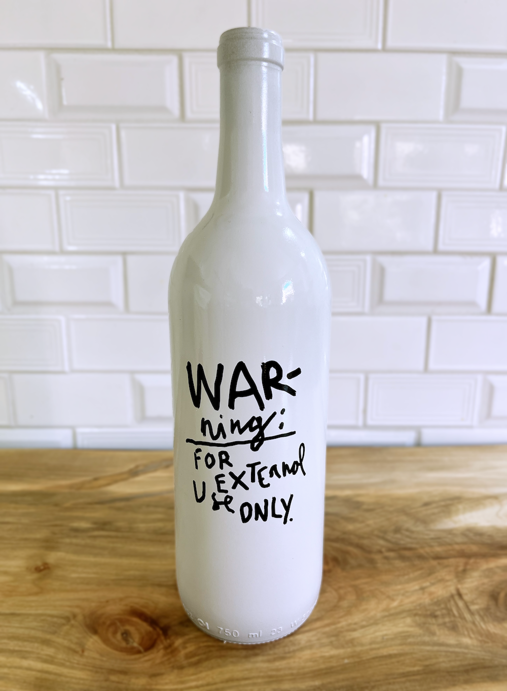 Merde Bottle — back